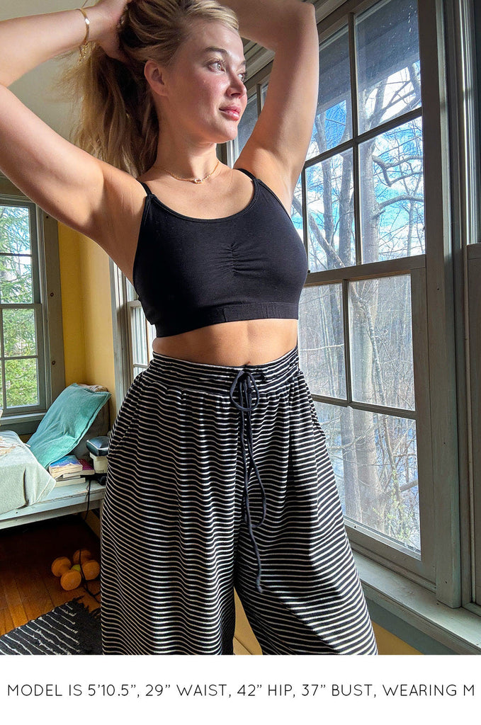 Model wearing black Miakoda Bralette. 