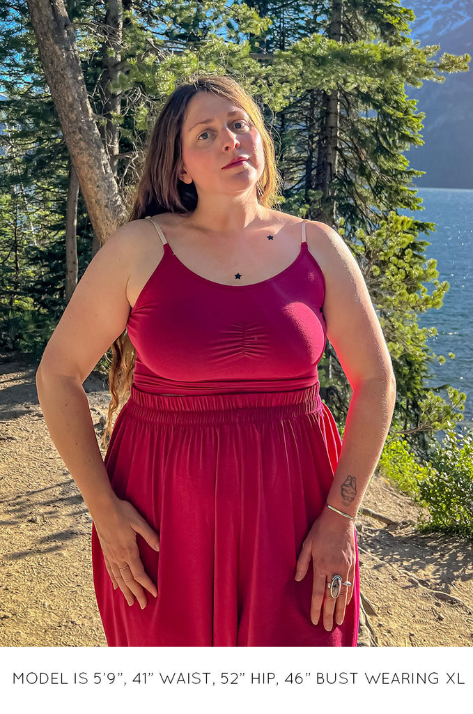 Model wearing pink Miakoda Brami crop top. 