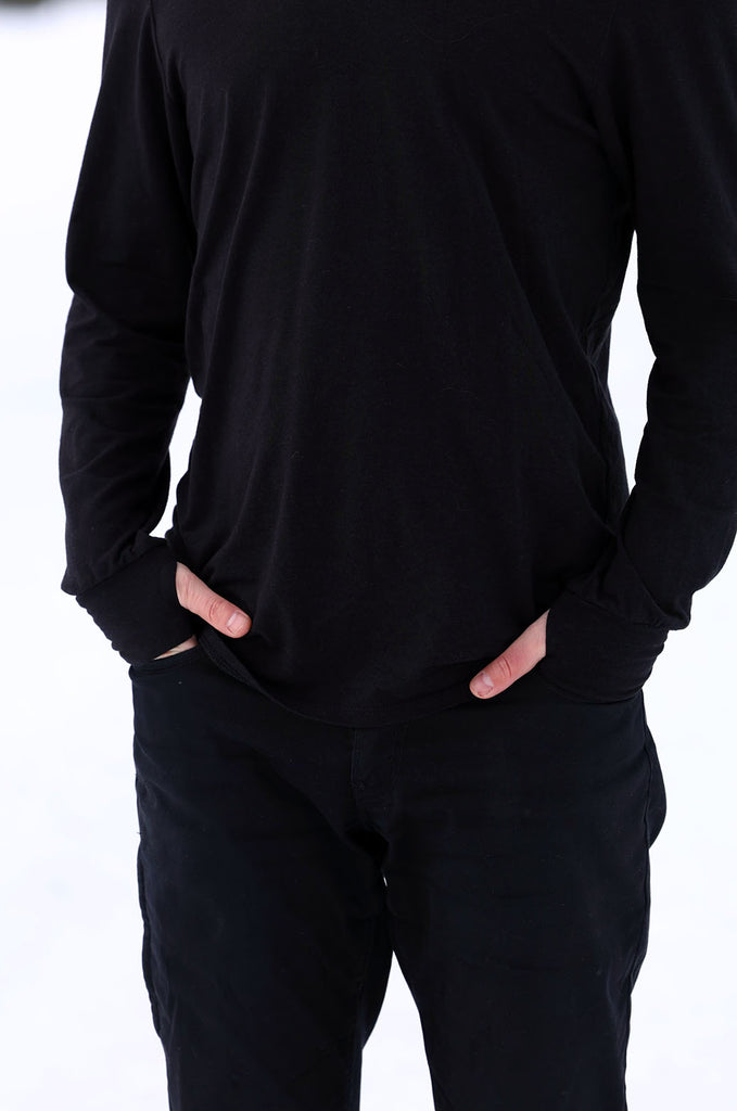 Model wearing black oversized long sleeve tshirt by Miakoda. 