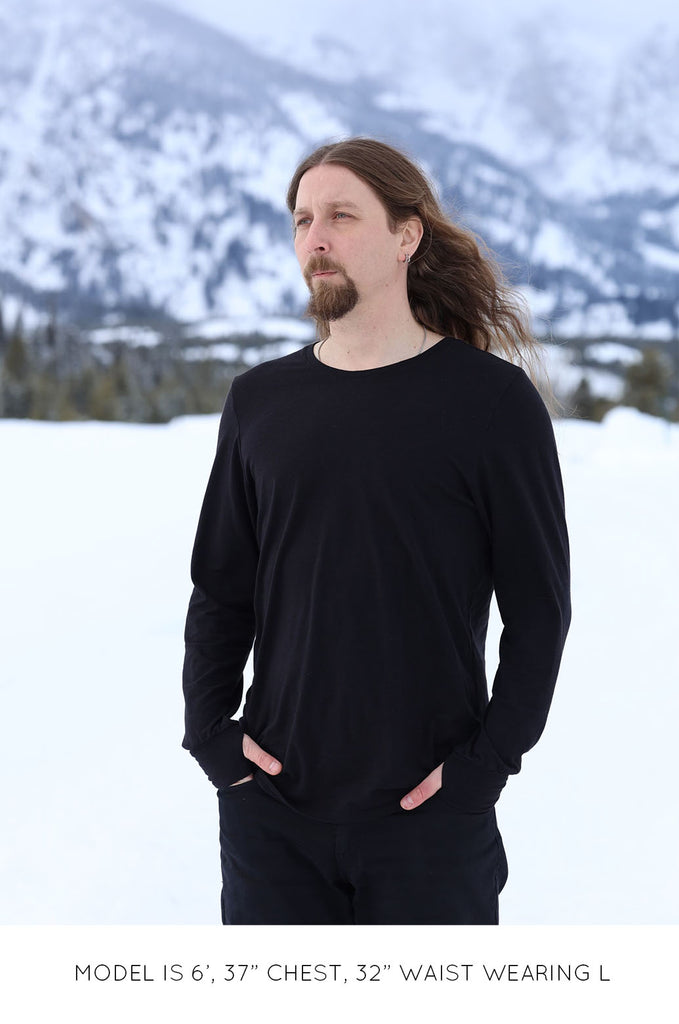 Model wearing black oversized long sleeve tshirt by Miakoda. 