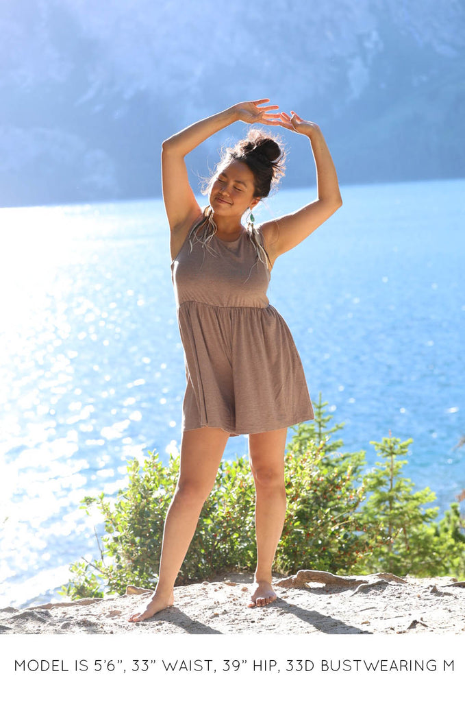 Model by lake wearing latte brown Summer Romper by Miakoda. 
