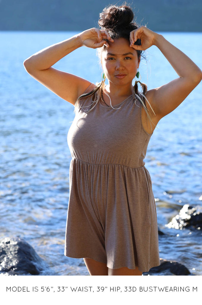 Model by lake wearing latte brown Summer Romper by Miakoda. 