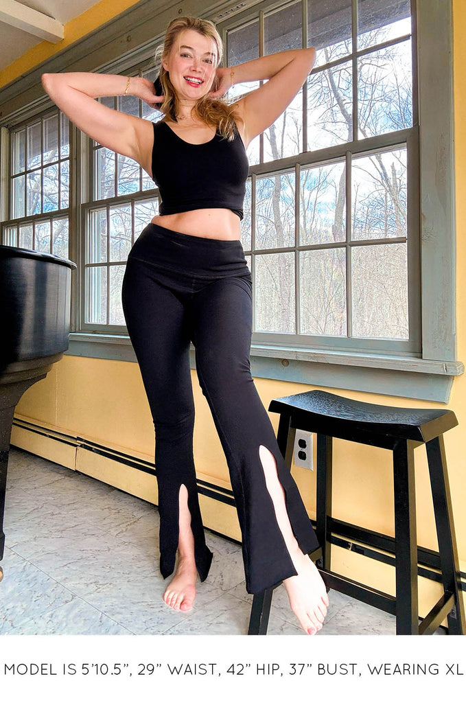 Model wearing black crop top and Split Leggings by Miakoda. 